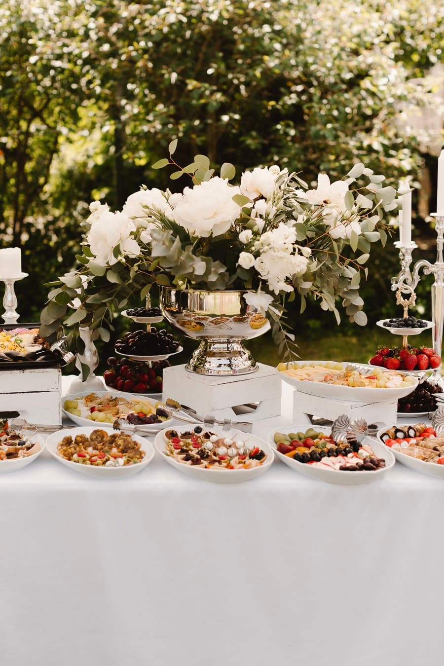 Garden dessert and canape table styled with white florals and eucalyptus